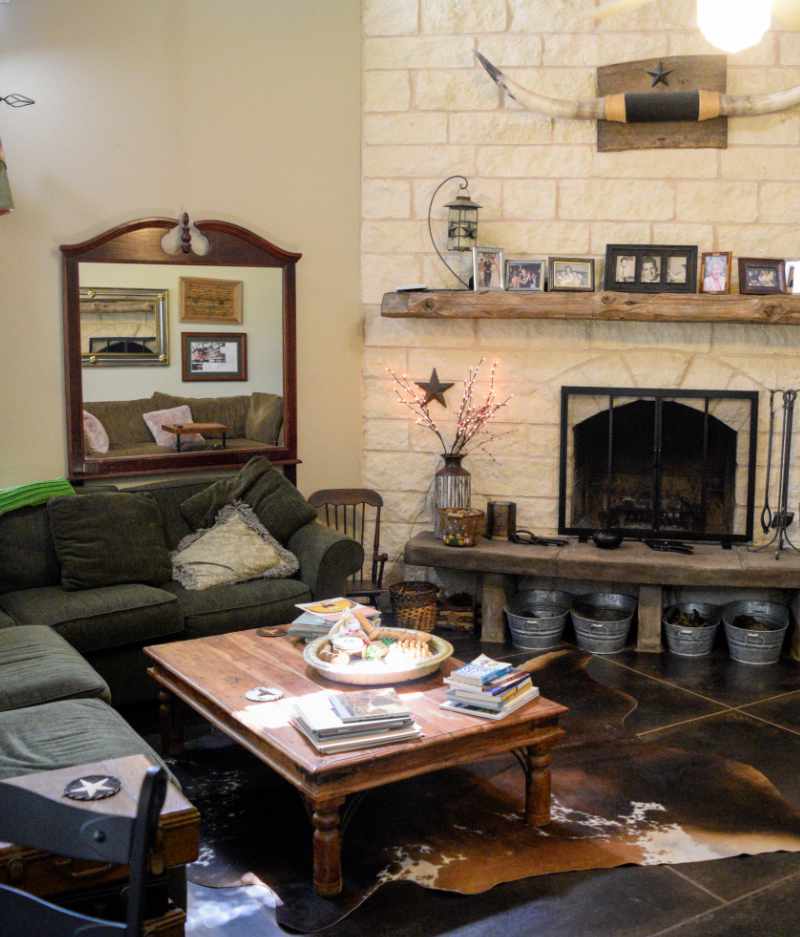 Cozy living room with stone fireplace and rustic decor