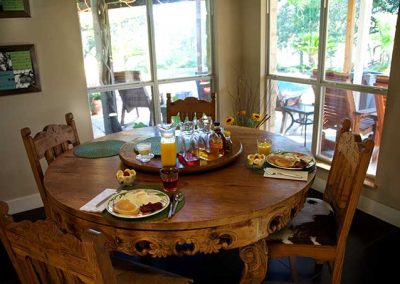 Homestyle breakfast setup on wooden dining table