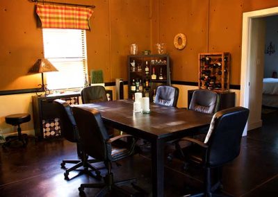Cozy dining room with wooden table and liquor cabinet