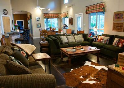 Cozy living room with plush sofas and rustic decor