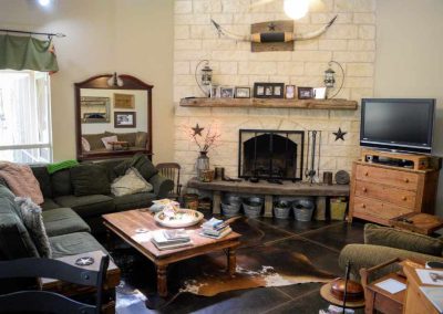 Cozy living room with fireplace and rustic decor