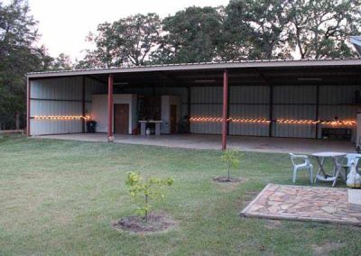 Rustic outdoor pavilion with string lights at dusk