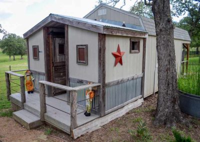 Rustic wooden shed with red star decor in garden