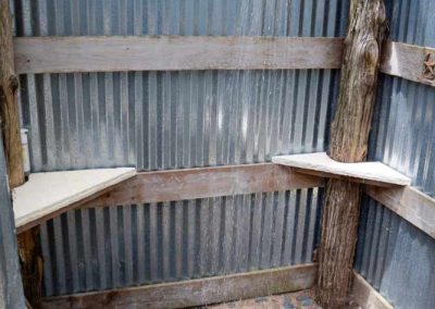 Rustic outdoor shower with wooden and metal elements