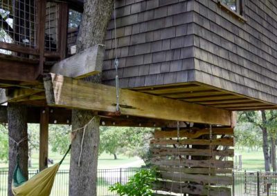 Treehouse with hammock under shade trees