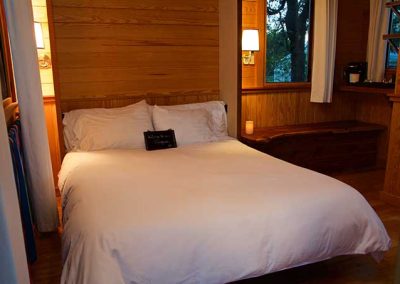 Cozy bedroom with wooden interiors and soft lighting