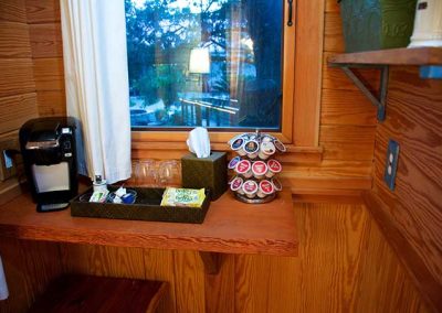 Cozy coffee station with machine and capsules by window
