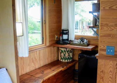 Cozy wooden cabin interior with window and furnishings