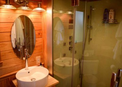 Modern bathroom with wooden accents and glass shower